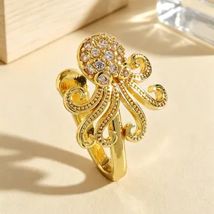 Detailed macro view of a gold octopus-shaped non-piercing nose clip with zirconia stones