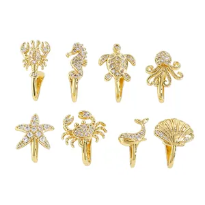 Collection of eight gold non-piercing sea animal nose clips with zircon inlay