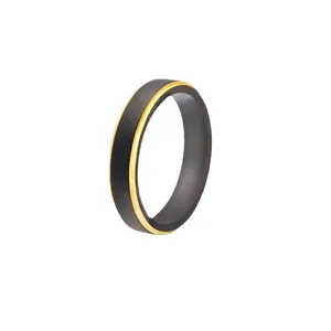 Minimalist black and gold tungsten carbide ring with interior TUNGSTEN CARBIDE engraving