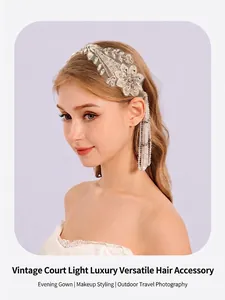 Detail of French vintage bridal headpiece with lace flowers and pearl tassels