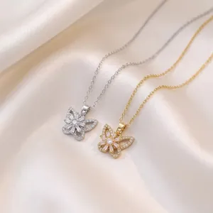 Close-up macro view of rotating butterfly pendants with sparkling white zirconia stones