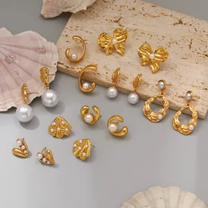 Macro view of French style gold stainless steel pearl earrings in various designs