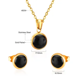 Détail de l'ensemble de bijoux en acier doré avec pierres oeil-de-chat noires et mesures.
