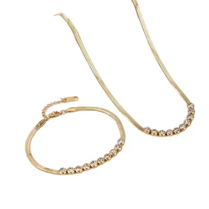 Minimalist gold titanium steel necklace and bracelet set with sparkly rhinestone accents.