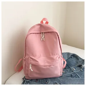 Detail view of the lightweight pink Japanese style backpack featuring cute white rope zippers