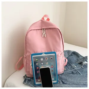 Detail showing pink backpack scale with tablet and phone for school or travel