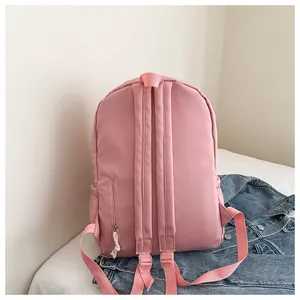 Rear view of a cute pink minimalist backpack for students with adjustable straps