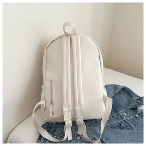 Detailed back view of a minimalist cream-white backpack showing straps and zipper