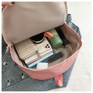 Internal capacity view of cute pink Japanese style school backpack with essentials