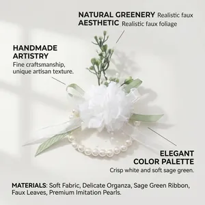 Close-up of elegant forest style wrist corsage with sage green ribbons and white flowers
