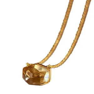 Luxury minimalist irregular cut amber crystal gemstone necklace with a fine gold chain