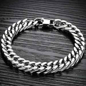 Close-up detail of a polished double-weave Cuban link bracelet in silver stainless steel.