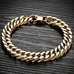 Close-up view of gold titanium steel Cuban link bracelet with double-weave detail.