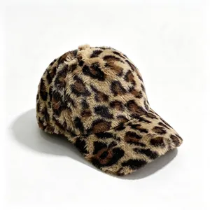 Close-up detail of a stylish leopard print baseball cap featuring thick faux fur.