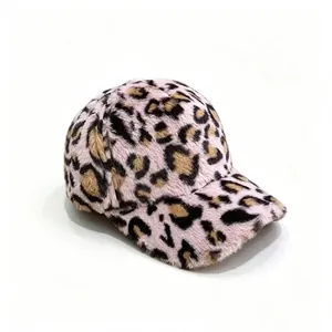Detail shot of a plush pink leopard print baseball cap showcasing its soft faux fur texture