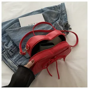 Detailed interior view of the red heart-shaped bat wing bag showing storage capacity