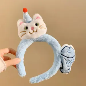 Cute plush cat headband with party hat and blue fish, perfect for cosplay and parties.