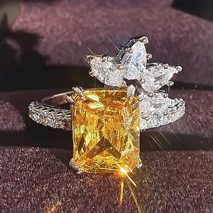 Macro detail of vintage floral ring with a radiant square yellow zircon center stone