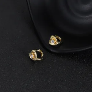 Elegant gold heart-shaped hoop earrings with central clear zircon stone for women