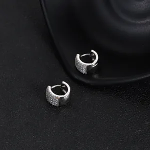 Elegant silver-tone geometric huggie hoop earrings with micro-paved sparkly zirconia
