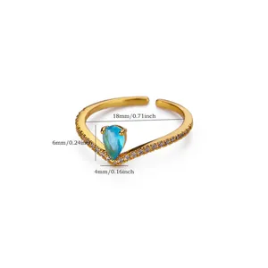 Détail d'une bague ouverte en acier doré avec cristal bleu et dimensions indiquées.