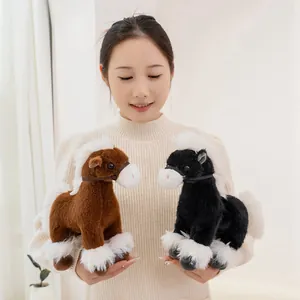 Close-up of soft brown and black simulation pony plush toys held by a female model