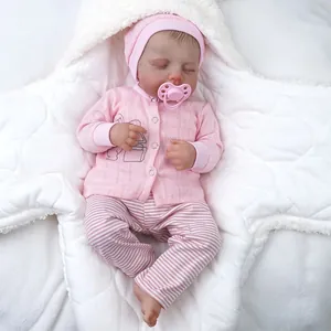 Realistic 19-inch reborn baby doll sleeping in a plush star-shaped swaddle blanket