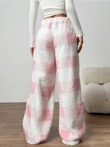 Back view of plush pink and white checkered wide-leg pants for winter warmth