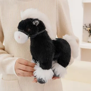 Detailed view of a soft black and white horse plush toy with fluffy mane and tail