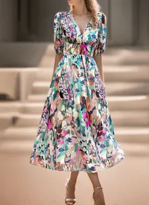Detailed view of an elegant floral print maxi dress featuring a V-neck and short puff sleeves.