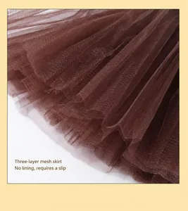 Macro shot of 3-layer brown tulle mesh skirt fabric detailing the texture and layers
