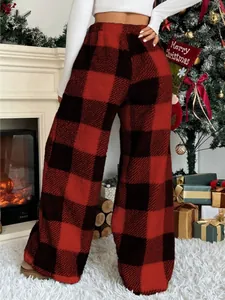 Cozy red and black buffalo plaid wide-leg fleece pants for winter Christmas home wear.