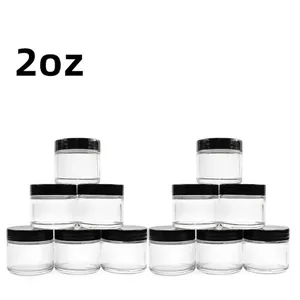 Set of twelve 2oz clear glass jars with black screw lids for cosmetic and cream storage.