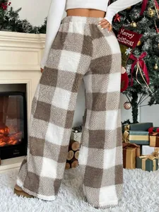Back view of cozy beige plaid sherpa wide-leg trousers showing warm texture