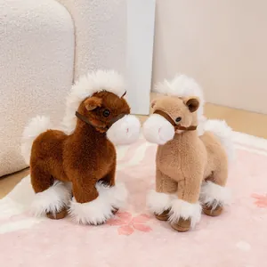 Pair of cute realistic plush horse toys with fluffy white manes on a pink rug.