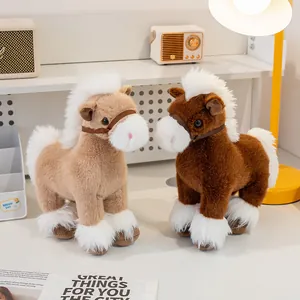 Detailed view of two fluffy plush horse toys in brown and tan colors on a bright desk