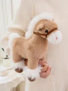 Detail showing a soft brown realistic plush horse toy with white mane held in hand.