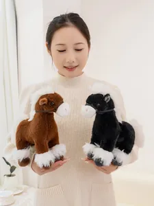 Asian model holding two realistic brown and black plush horse dolls with soft white fur details