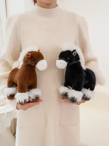 Detail shot of two realistic plush horse toys in brown and black with soft white mane.