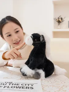 Realistic black and white horse plush toy with soft fur being touched by a person