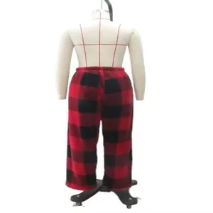Back view of thick red and black buffalo plaid trousers on a mannequin.