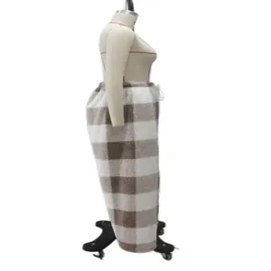 Detailed side view of winter warm plaid loose casual pants on a professional mannequin
