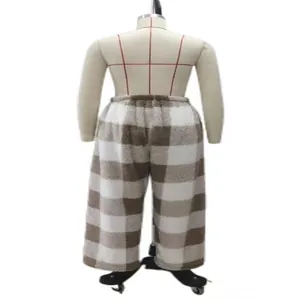 Detailed back view of plush fleece-lined plaid lounge pants displayed on a mannequin