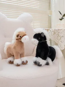 Realistic brown and black horse plush toys standing on a plush white armchair