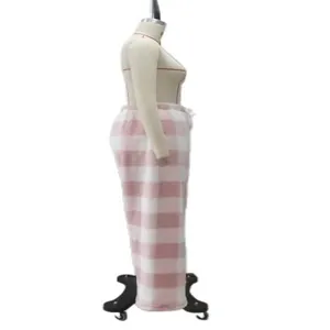 Side view of pink and white checkered plush warm trousers displayed on a mannequin