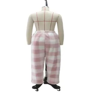 Back view of pink and white checkered plush lounge pants on a torso mannequin