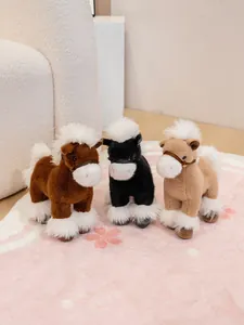Group of three fluffy plush horse toys in brown, black, and tan standing on a rug.