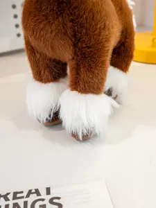 Detailed close-up of brown plush horse toy legs with soft white fur accents
