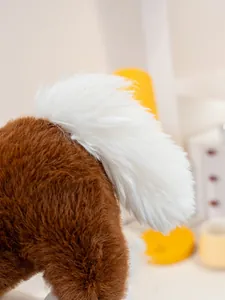 Detailed macro view showing the fluffy white fur tail of a soft brown plush horse toy