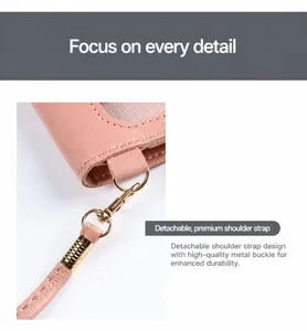 Close-up detail of the detachable shoulder strap and durable metal buckle on this stylish pink phone bag.